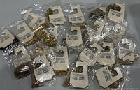 Clear plastic-bagged A New Day necklaces on display cards