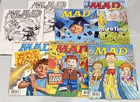 Group shot of all seven magazines laid out