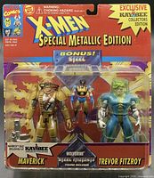 Front of sealed blister showing all three figures and accessory