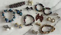 Group shot of entire lot showing all bracelets and earrings