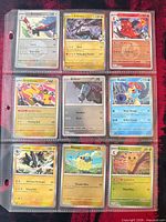 Nine sleeved cards in 3×3 binder page