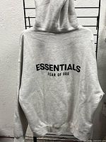 Back view showing large Essentials Fear of God logo and overall color