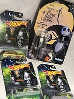 Overview of Jack Skellington figure and three Hot Wheels Halloween cars in packaging