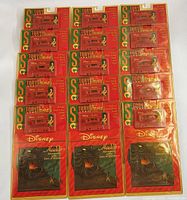 Front view showing all 15 sealed book-and-tape packs in rows