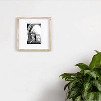 Front view of frame on wall displaying size and color