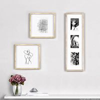 Front view of three frames arranged on wall