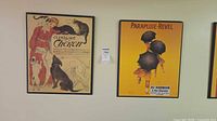 Both wood-mounted poster prints on wall