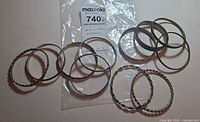 All eleven bangles laid flat showing quantity and mix of finishes