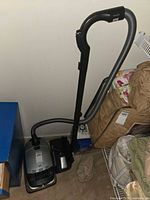 Full view of Miele vacuum with hose, wand and powerhead