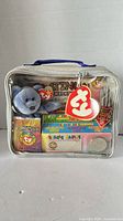 Front view of sealed Ty Platinum Membership set showing bear, card packs, coin, case