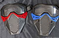 Front view of both masks showing red and blue trims and lenses