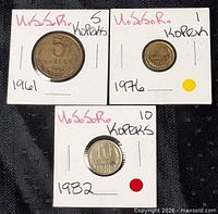 Group shot of three USSR coins in cardboard flips: 5 kopeks 1961, 1 kopek 1976, 10 kopeks 1982