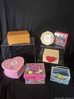 Group shot of all boxes and photo frame on risers