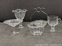 group view of four pressed glass pieces