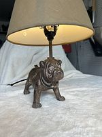 Front view of bulldog lamp lit with shade