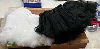 White and black petticoats laid out on table