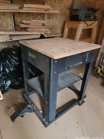 Overall view of DeWalt steel work table showing plywood top and frame
