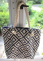 Front view of navy and cream diamond tote showing pattern and rope handles