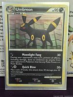 Front view of Umbreon holographic card showing artwork, set symbol and card number 10/90