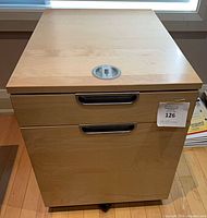 Front view of maple laminate 2-drawer filing cabinet on casters