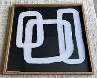 front view showing abstract design and frame