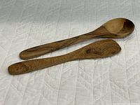 Top view of both olive wood utensils showing overall design and grain