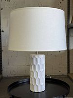 Full view of lamp showing base and shade