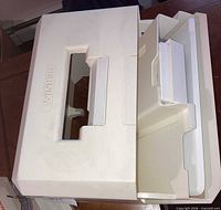 Hard plastic carrying case showing handle and molded Bernina logo