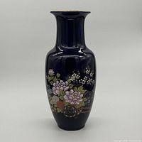 Front view of dark blue porcelain floral vase with floral motif