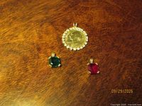 Front view of all three pendants on wood surface