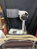 Dust collector unit with hoses, clamps, manual and bags on table