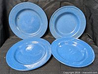 All four blue speckled enamel plates displayed together