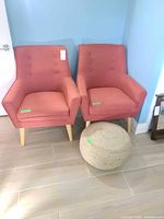 Front view of both accent chairs and ottoman