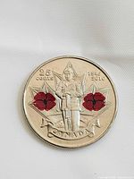 Reverse of 2010 Canada 25-cent Armistice coin with soldier and red poppies