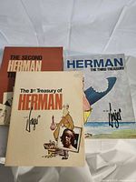Front covers of all three Herman Treasury books