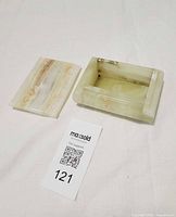 box with lid removed, showing interior and size tag
