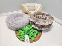 All three beds and snuffle mat grouped