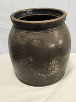 Full view of dark brown stoneware crock