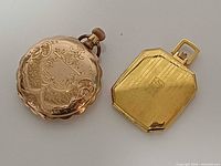 Two gold filled pocket watch cases side by side