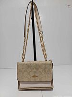 Front view of Mini Klare bag hanging to show full design and strap