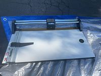 Full view of Rotatrim Mastercut II trimmer showing base, rail and clamp