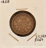 Reverse showing crown, 20 cents denomination, maple wreath, date 1858