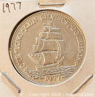 Obverse view showing ship design and 1977 date