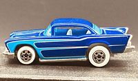 Left side profile of blue '57 Chevy Bel Air diecast car