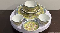 Full set stacked—plate, saucers, cups