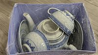 Entire tea set in lavender gift box, wrapped in plastic