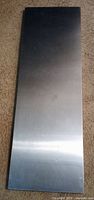 Top view of stainless steel panel showing polished surface