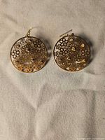 Front view of both earrings showing floral filigree and crystals