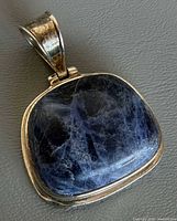 Front view of pendant showing sodalite stone and silver bezel