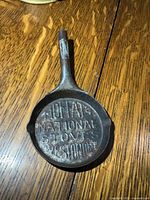 Top view showing full pan and raised lettering